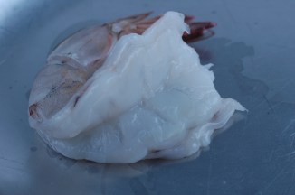 Don't cut all the way through, just so it can lay flat