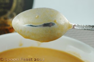 Perfect consistency is when the soup coats the back of a spoon and it stays separated when you draw a line through it with your finger.