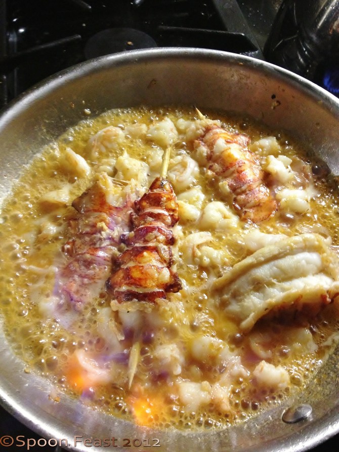 Saute and deglaze the lobster and shrimp with brandy before adding to the bisque.