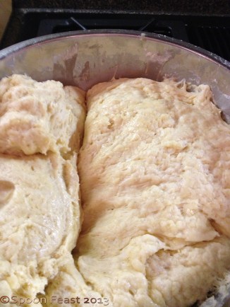 Risen dough about to hit the work bench