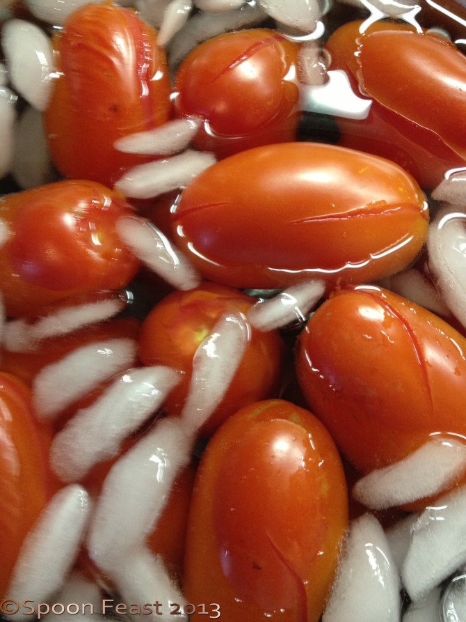 When the skin splits, plunge into ice water to stop cooking.