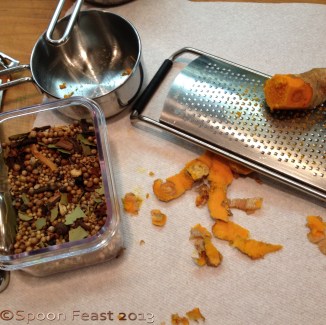 Grating fresh turmeric