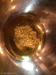 Melting beeswax and jojoba oil