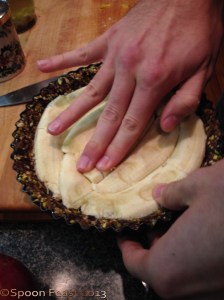 Flatten the bananas into the pan, cut side down.